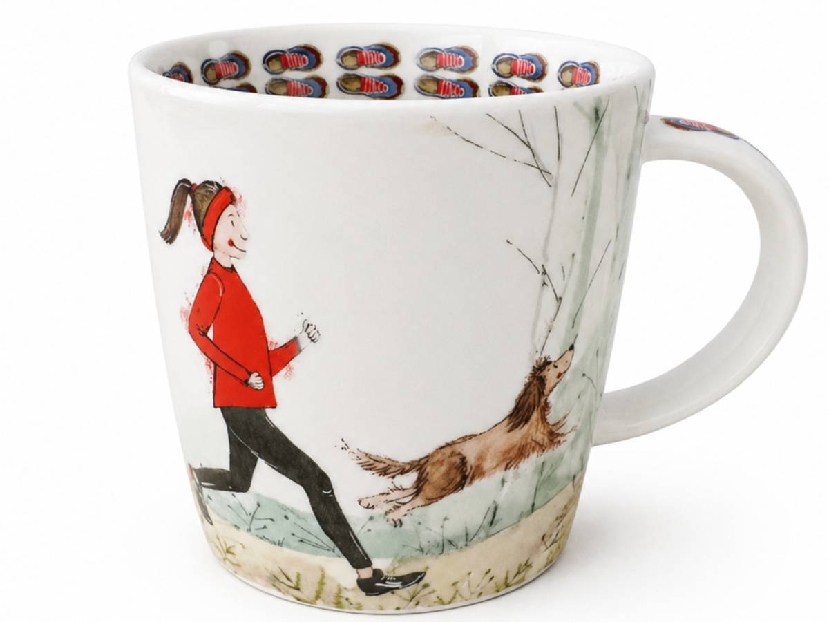 A white ceramic mug featuring a whimsical illustration of a woman in a red jacket running alongside a brown dog in a snowy outdoor scene. The inside of the mug is decorated with a repeating pattern of colorful shoes.