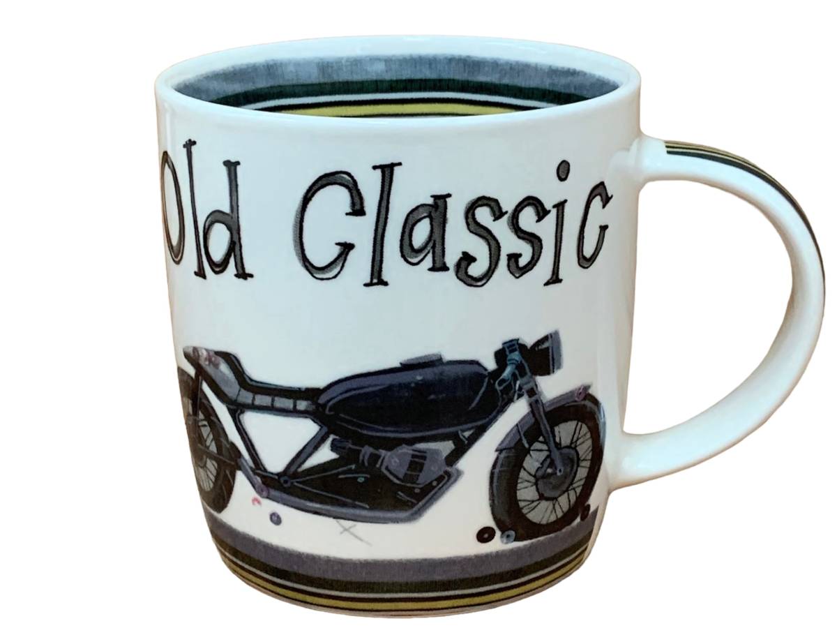 A white ceramic coffee mug featuring the words 'Old Classic' in black stylized lettering and a black vintage motorcycle illustration on the side.
