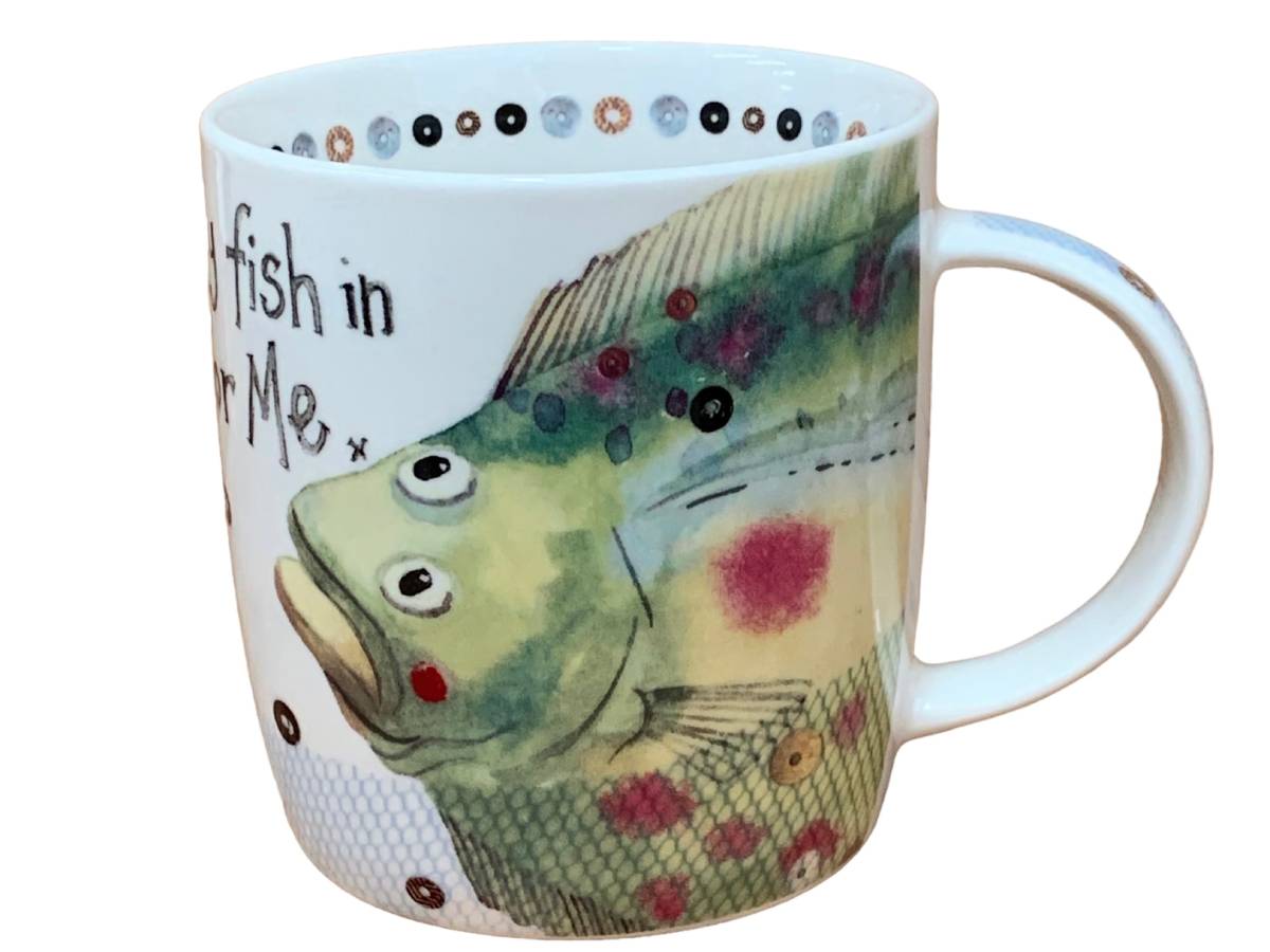 A white ceramic mug featuring a painted green and yellow fish with red spots, black text, and a dotted pattern around the inner rim, shown on a plain white background.
