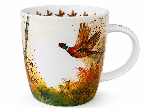A white ceramic mug featuring a detailed watercolor-style illustration of a pheasant bird in flight over autumnal grasses with birch trees, shown on a clean white background.