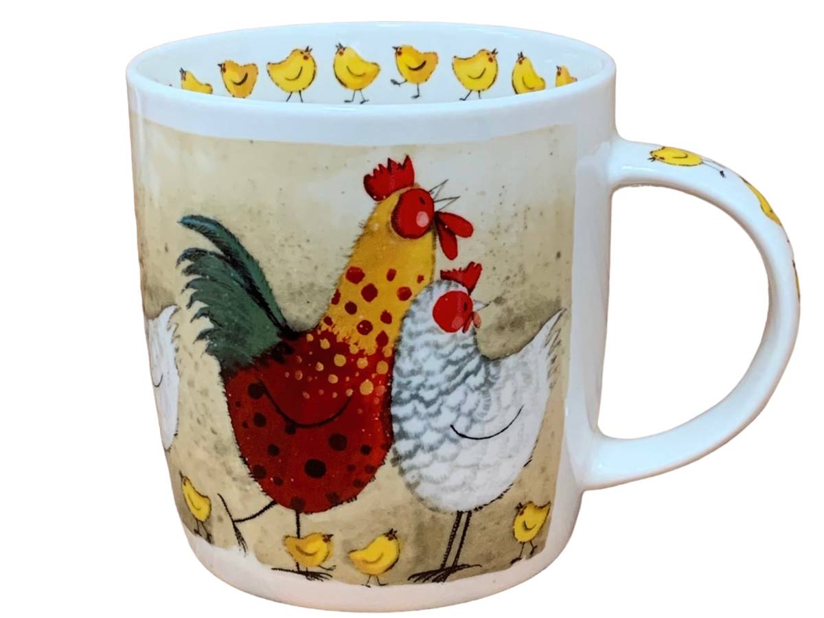A white ceramic mug featuring a whimsical illustration of a red and yellow rooster, a white hen, and several small yellow chicks on a textured beige background.