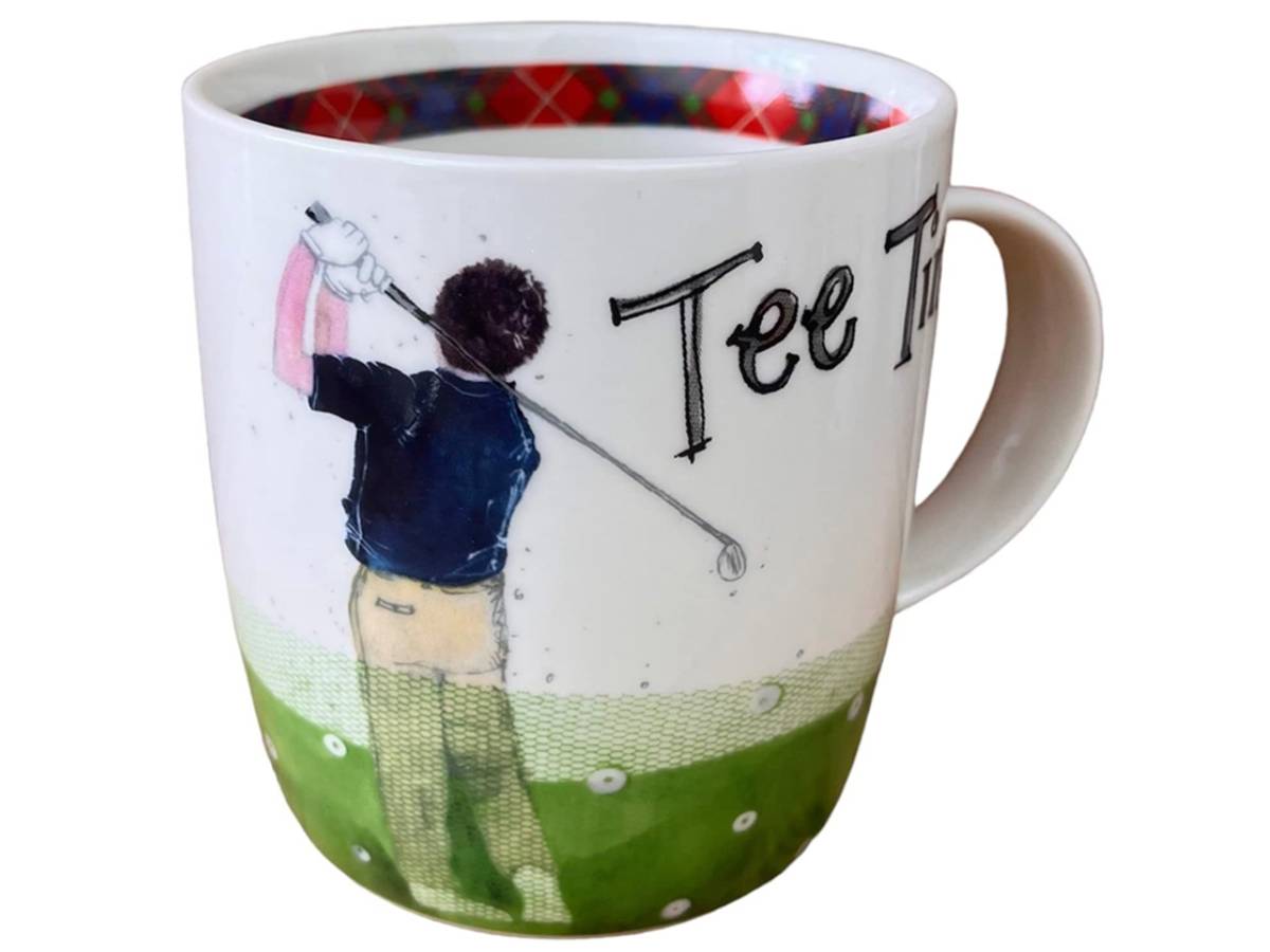 A white ceramic coffee mug featuring a golf-themed illustration of a golfer mid-swing, with the text 'Tee To.