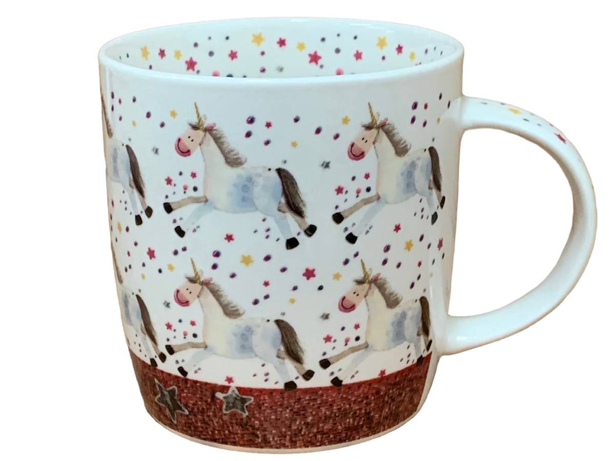 A white ceramic mug decorated with a whimsical pattern of white unicorns with dark manesfs, colorful stars, and a glittery brown base.
