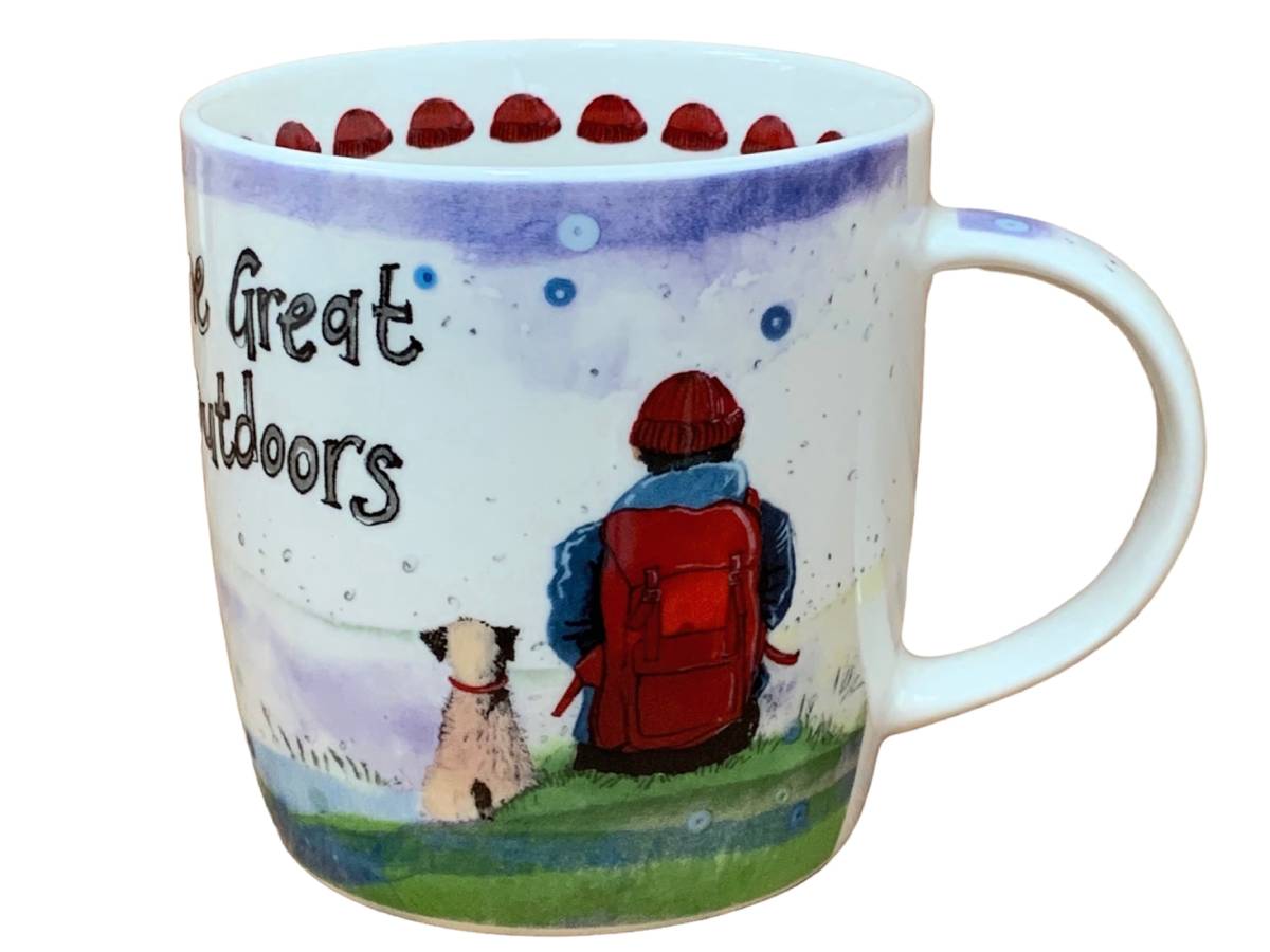 A white ceramic coffee mug featuring a whimsical illustration of a person with a red backpack and a dog on a grassy hill under a purple sky, with the text 'The Great Outdoors' printed on the side.