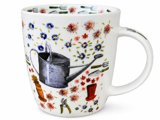 A white ceramic mug decorated with a colorful gardening pattern featuring a watering can, flowers, tools, and boots.