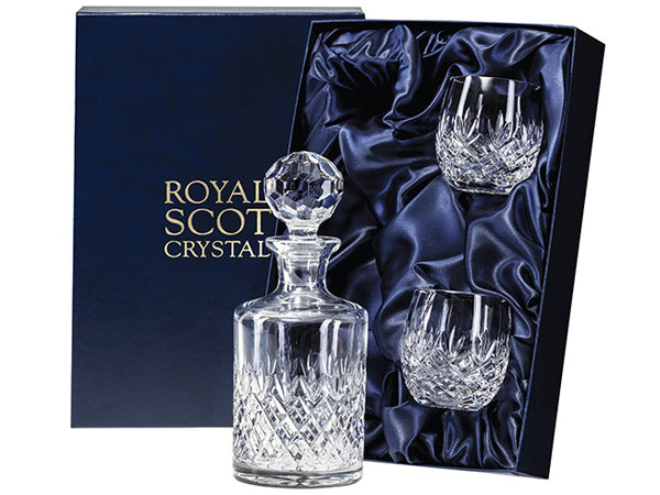 A matching decanter and tumbler set with a pleasantly rounded shape. The hand-cut design features a bed of diamonds topped by a triple-flicked motif. The decanter has a multi-faceted globe-shaped stopper