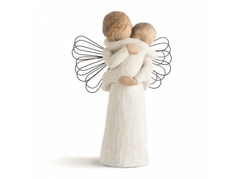 A cast stone figurine of an faceless angel holding a small faceless child in a tender embrace. The figurines are featureless for your own personal interpretation. They both wear cream outfits crackled with brown and are painted in earthy colours with short hair. The angel has wire wings protruding from her back.