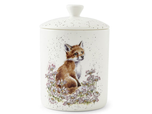 White fine bone china storage jar with lid, showcasing a watercolour illustration of a fox cub amidst a field of daisy flowers. Hannah Dale's iconic black speckles add a whimsical touch to the white background, reminiscent of specks on eggshells.