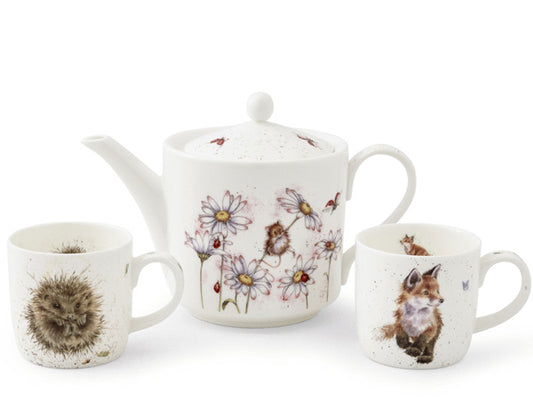 A porcelain tea for two set featuring a 2 pint teapot illustrated with a watercoloured mouse hidden among daisys. Accompanied by two matching sized mugs one with a fox cub and one with a curled up hedgehog.