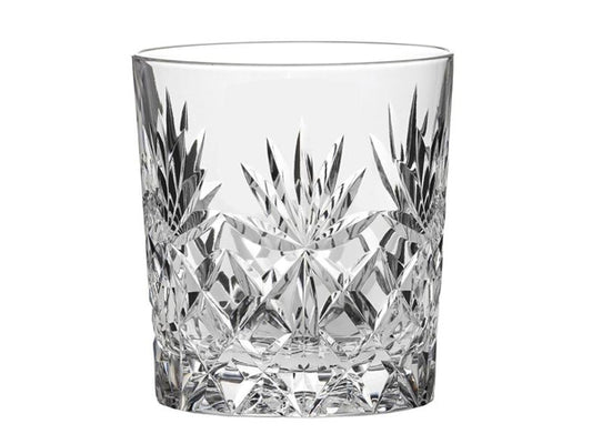 A large crystal tumbler with a cut design featuring a bed of diamonds around the base and seven-pointed fan around the sides with a smooth rim