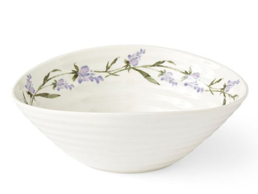 A white porcelain bowl that has been designed with Sophie Conran's staple ripple design. Around the inner rim of the bowl can be found a chain of lavender stems, and the bowl is the ideal size for serving up a hearty portion of cereal.