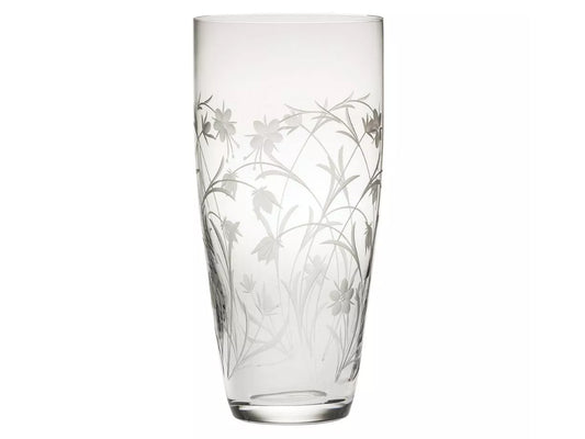 A tall crystal vase with a frosted floral pattern cut around the outside