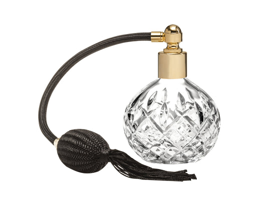 A classic crystal perfume atomiser with the iconic London cut around the outside, featuring gold hardware and a black puffer
