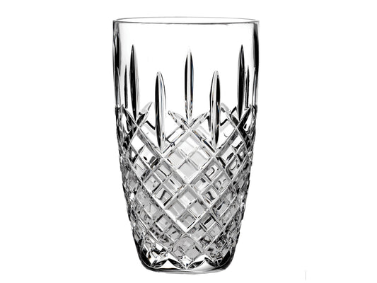 This Royal Scot Crystal London Vase - Barrel / Small has been hand-cut by expert craftspeople with their signature single-flicked London design. With a body that widens ever so slightly at the top, this vase is ideal for displaying any of your favourite flowers.