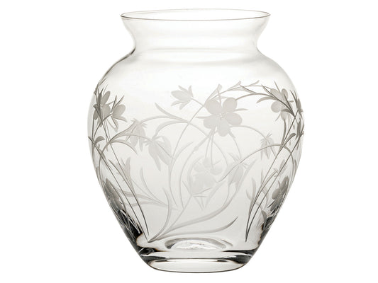A small crystal posy vase with a high waist and tapered neck. The outside is engraved with a winding wildflower design