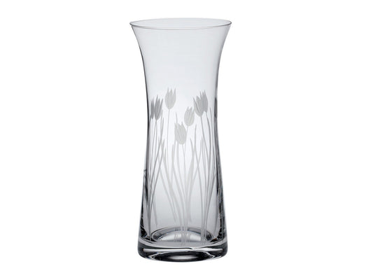 A slender waisted vase made of crystal, with a tulip motif engraved around the outside.