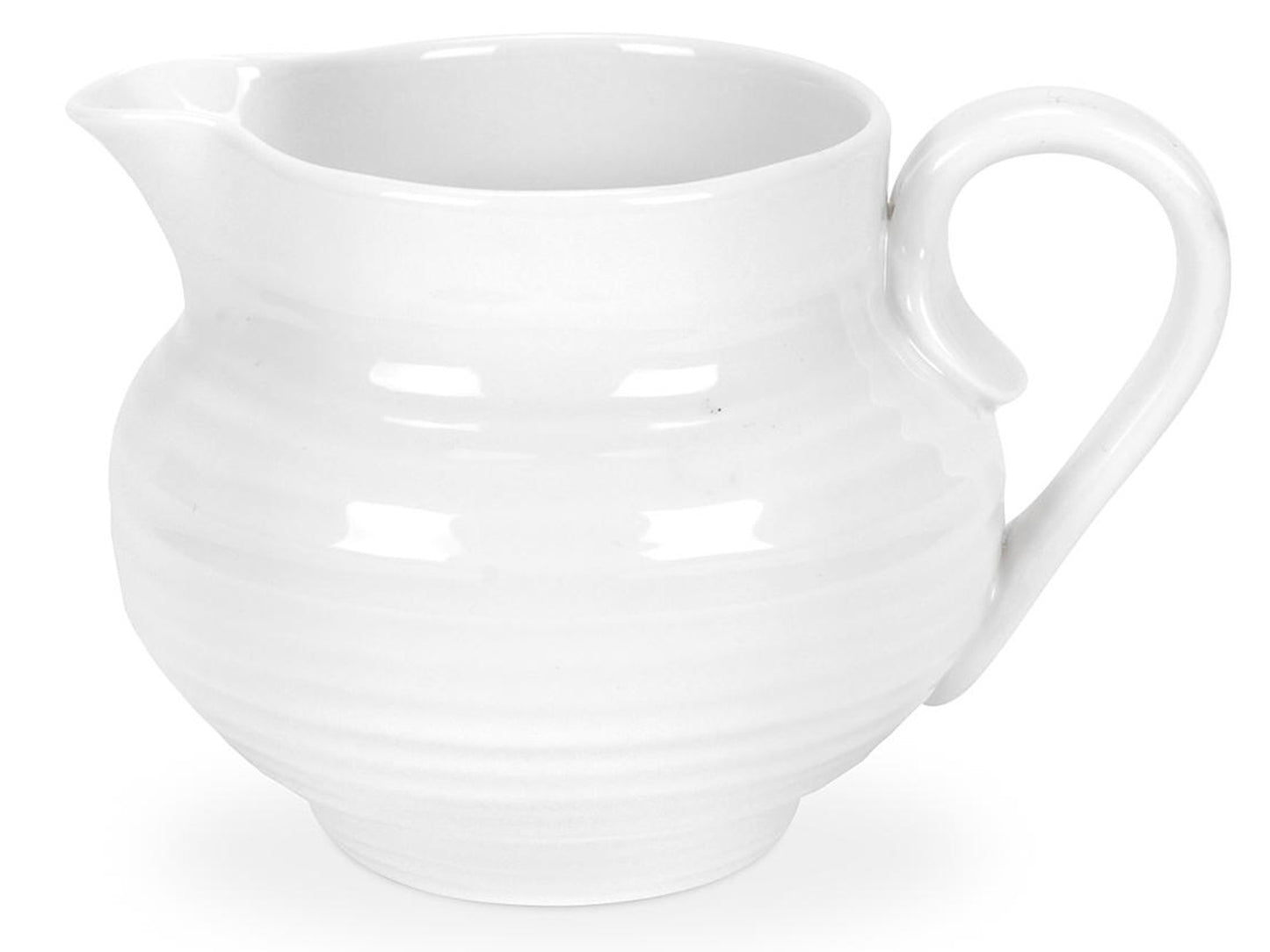 A rippled white porcelain jug with a stout body and small spout