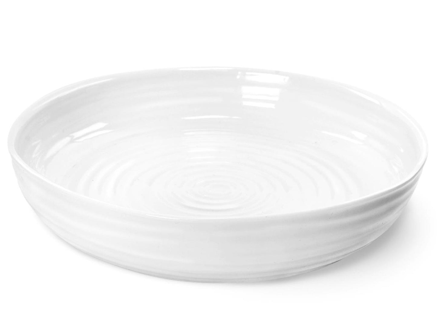 This Sophie Conran Round Roasting Dish is made of a white porcelain that has been finished with a clear glaze. Designed with Sophie's staple ripple effect, this dish is ideal for roasting large quantities of vegetables or potatoes, and is dishwasher, oven, freezer and microwave safe.