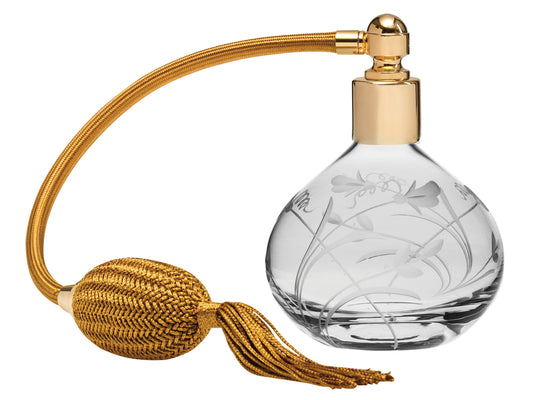 A classic round crystal perfume atomiser with a delicate sweet pea design etched into the outside of the crystal bottle. It has gold hardware and a golden puffer