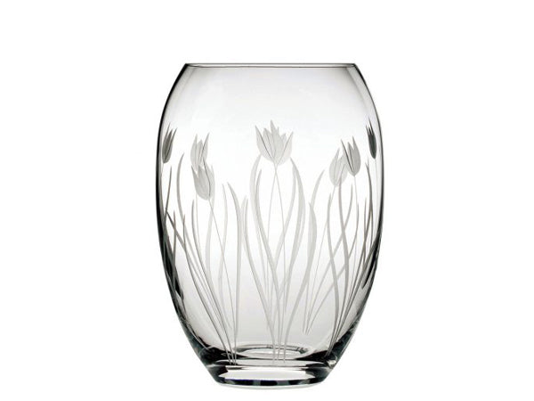 A small barrel-shaped crystal vase with a frosted tulip design cut into the exterior